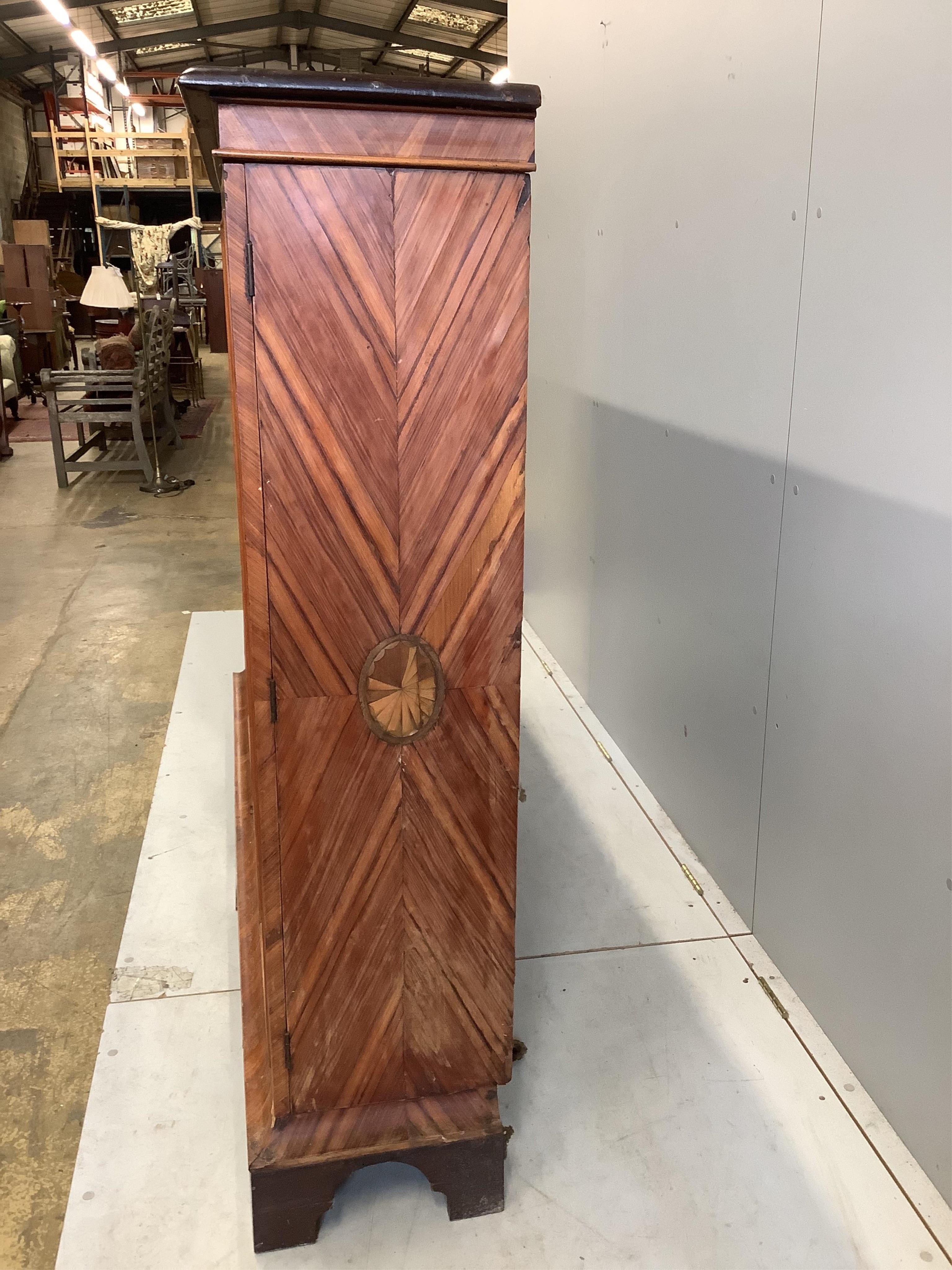 A large 19th century glazed kingwood bookcase, fitted four hinged doors and three adjustable shelves, width 190cm, depth 36cm, height 145cm. Condition - poor